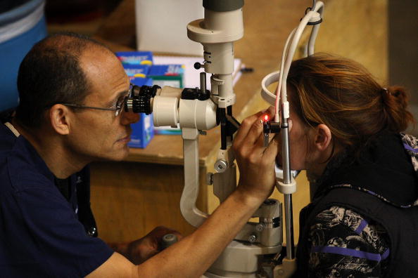 An eye exam is performed at the Remote Area Medical (RAM) clinic at the Los Angeles Sports Arena on April 27, 2010 in Los Angeles, California.  Meanwhile in the UK, Oxford Eye Hospital successfully pe