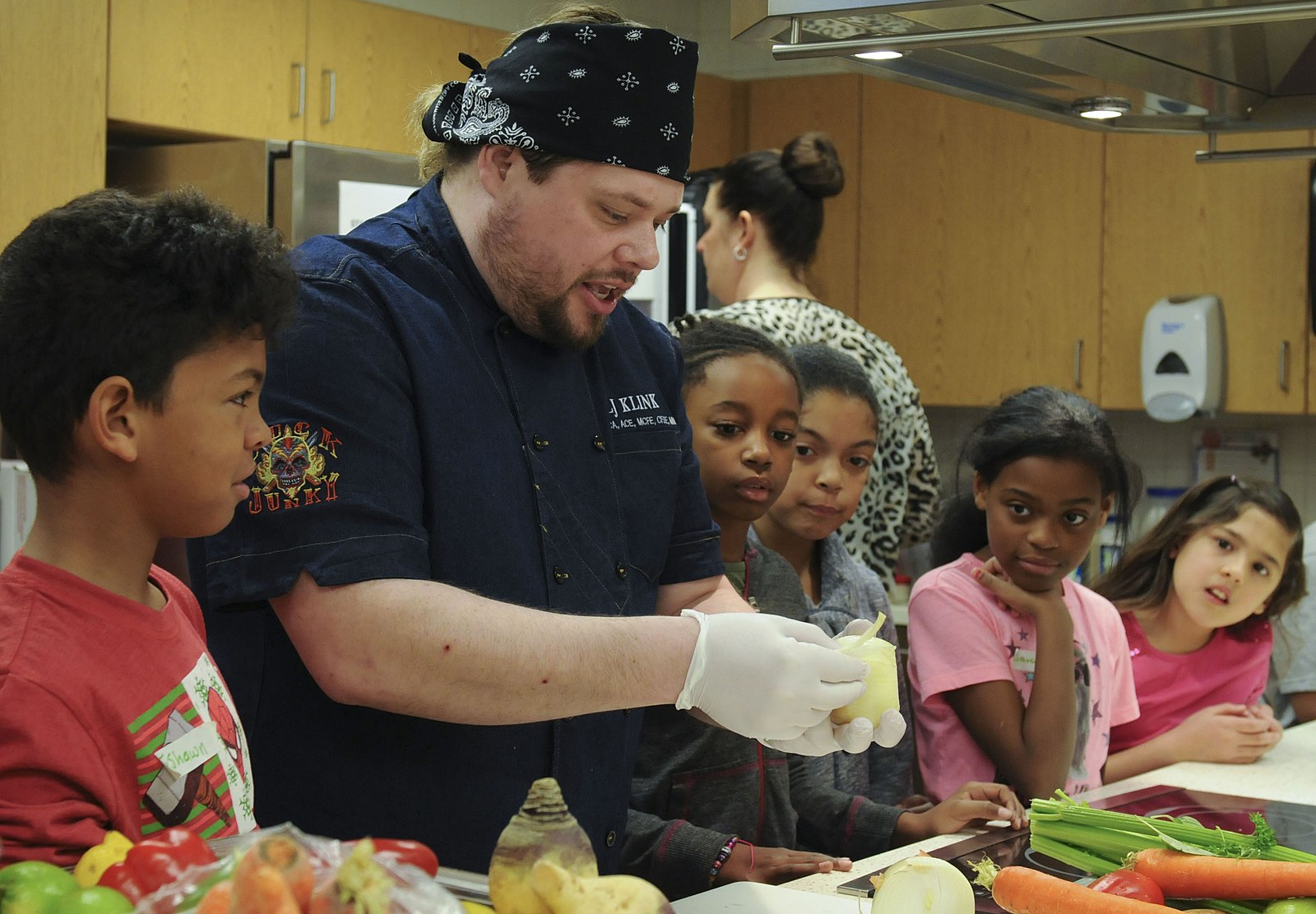 children prepare healthy meal with a chef
